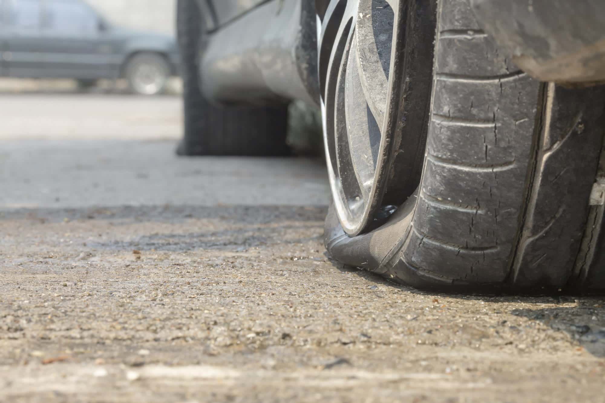 car flat tire on road